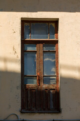 Fototapeta na wymiar Old balcony doors on the wall.