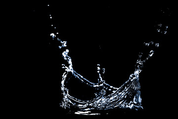 Splashing water on a black background. Water splashes on a black background. diffused water abstract