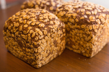 Whole grain bread with oat outside contained with wheat flour, eggs, sugar, butter and whole grain and baked. It’s served as breakfast meal.
