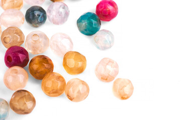 Natural agate beads on a white background are isolated