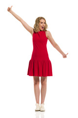 Happy Young Woman In Red Mini Dress And Sneakers Is Showing Thumbs Up And Shouting.