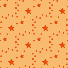 Fototapeta na wymiar Seamless pattern in bright orange stars on light orange backgound. Vector image.