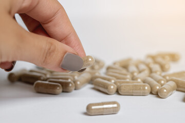 Vitamine E capsules on a white background