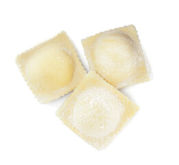 Uncooked ravioli with filling on white background, top view