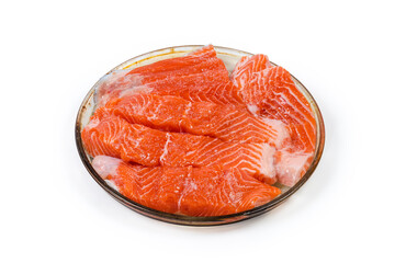 Trout fillet pieces prepared for baking on glass baking dish