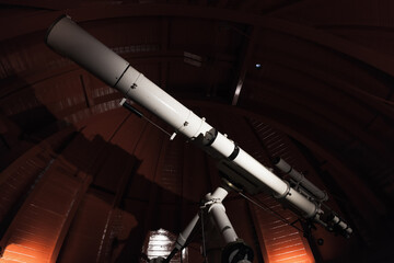 Professional telescope is in an observatory