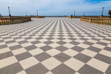 Terrace by the sea in Terrazza Mascagni, Livorno, Italy with a checkerboard floor