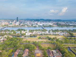 city, landscape, village, mountain, river, building, pagoda, church, field, park, school, market, lagoon, citadel, bridge, museum, hill, pass, beach, calm, hotel, lake, water, sky, nature, clouds