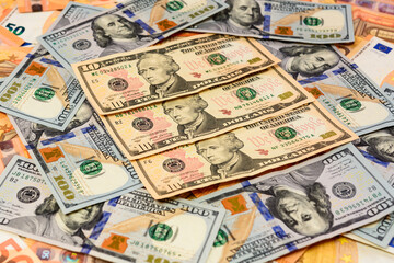 Many dollars and euros, texture of money, the advantage of the euro over the dollar.