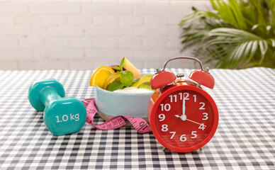 Selective focus of Red Alarm clock for Intermittent fast program plan as Healthy lifestyle, food,...
