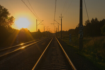 Naklejka na ściany i meble railway in the sunset