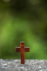 The sun shining in the forest. and Wooden Cross.