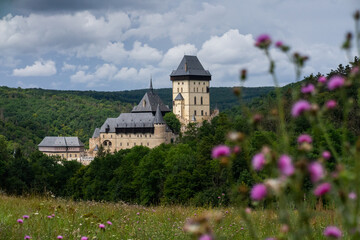Karlstejn Castle, historical building of the Czech Republic in the summer blooming scenery. Popular tourist destination/attraction near Prague.