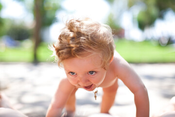 First steps. Cute toddler little child family concept, baby learning to walk , first step with childhood , small love portrait little boy at park. Photo step with childhood parent support, small love