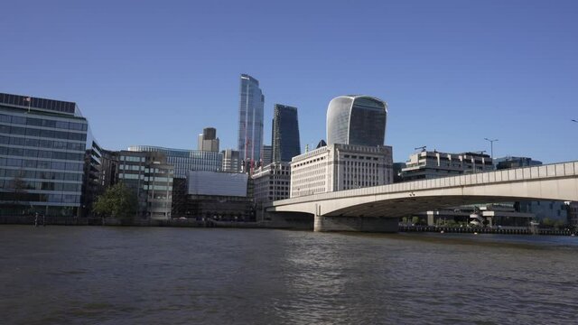 City of London and London Bridge from onboard River Thames cruise boat, London