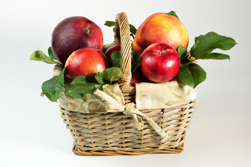Apples in the basket on the white background
