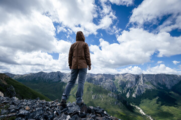 Hiker on high altitude mountain top