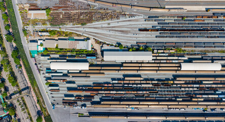 Aerial top view Passenger and freight trains on the railway station for transportation background. wagons with goods on railroad.