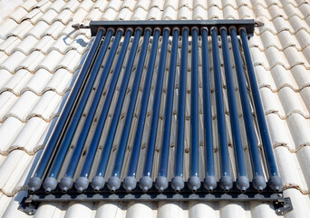 Close up of evacuated tubes on a rooftop.  Evacuated tubes are used to heat water using sunlight.