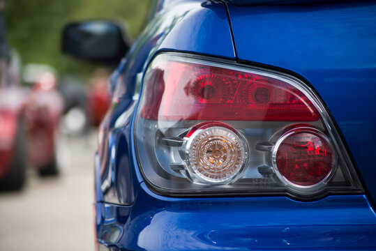Mulhouse - France - 8 August 2021 - Closeup of rear light of blue subaru impreza gt parked in the street
