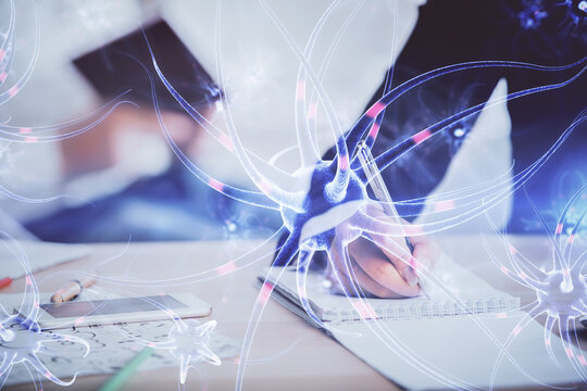 Double exposure of neuron theme drawing over people taking notes background. Concept of medical education