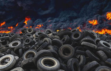 Tyres are on fire. Burning old tyres on recycling landfill. Black smoke from tires fire. Tyre...