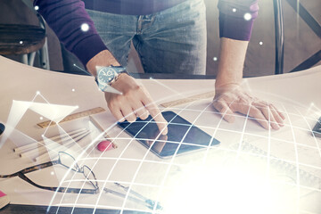 Multi exposure of man's hands holding and using a digital device and map drawing. International business concept.