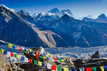 Colorful prayer flags on the Everest Base Camp trek in Himalayas, Nepal. View of Mount Everest and Mountain Peak Nuptse