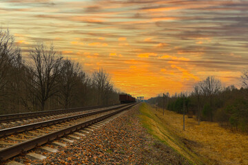 Beautiful picturesque sunset against the background of the railway.
