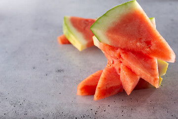 A view of several slices of watermelon.