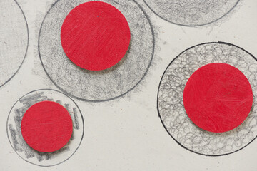 red wooden discs on graphite circles background