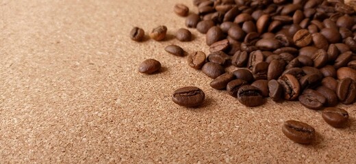 Roasted coffee beans on cork, wallpaper, the beans are on the right