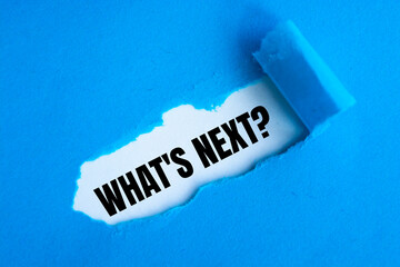 The words what's next appearing behind torn paper