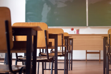 Elementary classroom, no kid or teacher, with chairs and tables. Education concept.