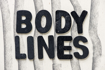 the words "body lines" on a paper background with wavy vertical lines