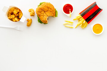 Set of junk food snacks with hamburger chicken nuggets and french fries