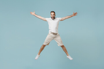 Full length young overjoyed fun cool happy caucasian man 20s wearing casual white t-shirt jump high...