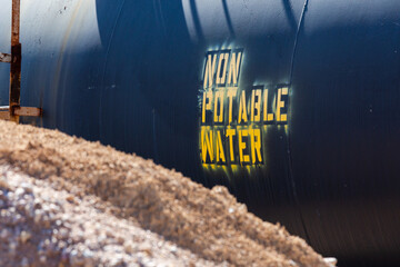 A sign warns that this tank contains non-potable water