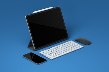 Computer tablet with keyboard, mouse and phone isolated on blue background.