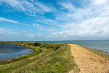 Footpath along The Solent Way trail at Lymington Hampshire England on a sunny summer day