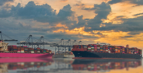 Logistics and container loading by large barges by sea in a harbor full of containers waiting to be transported