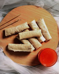 Lumpia is a typical Semarang cake. The spring roll cake is not fried, so the texture is soft. Blurred focus. Spring rolls consist of a thin sheet of wheat flour as a wrapper for the filling of eggs.