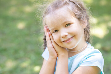Joyful emotions of a little cute girl, close-up portrait of a child.
