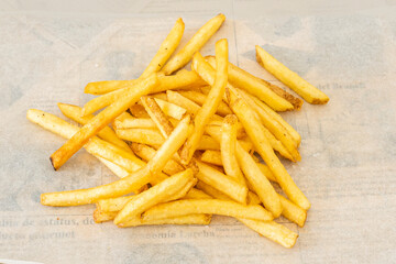 portion of classic french fries on a white greaseproof paper