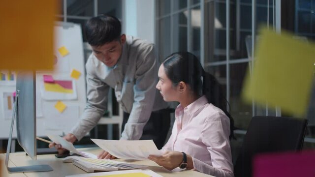 Asia group MBA college people or success man and woman talk in staff room work late in project digital reskill upskill job career workshop. Data analyst finance advice plan idea in sale report paper.