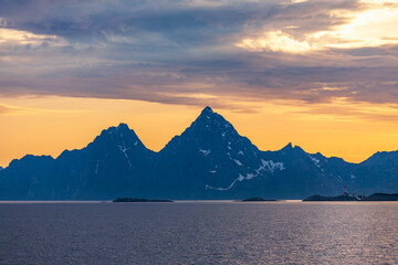 Scenic view at rocky coastline in sunset