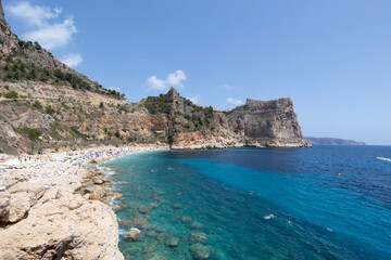 Fototapeta na wymiar Mediterranean hidden beach surrounded by cliffs in Alicante, Spain