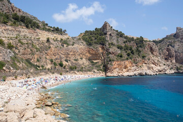 Mediterranean hidden beach surrounded by cliffs in Alicante, Spain