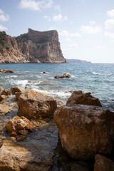Fototapeta na wymiar Mediterranean hidden beach surrounded by cliffs in Alicante, Spain