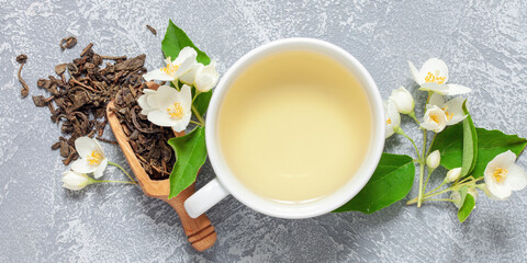 Obraz na płótnie Canvas Tea with jasmine in a cup. Ceremony concept. Top view